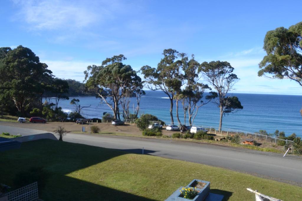 a view of the ocean from a house at Lufra Hotel and Apartments in Eaglehawk Neck