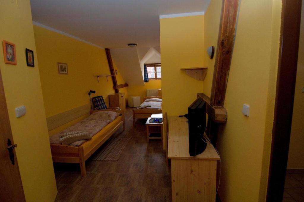 Postel nebo postele na pokoji v ubytování Hotel Na Hradbách