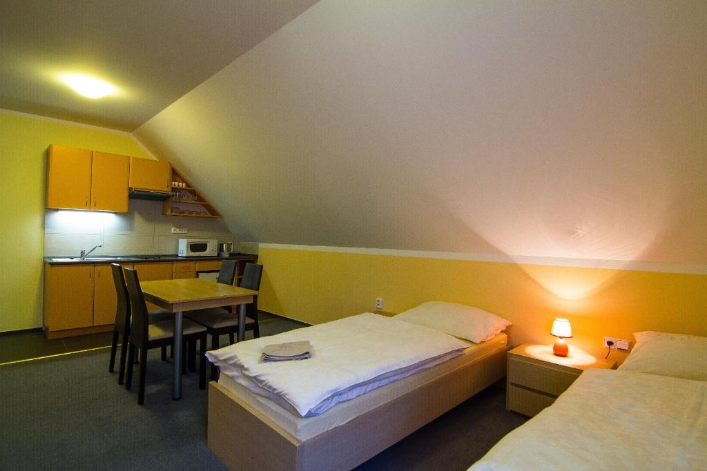 Postel nebo postele na pokoji v ubytování Apartmány Sport with Garage