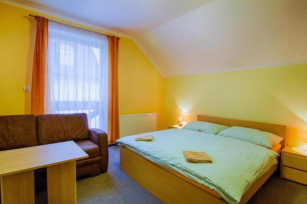 Postel nebo postele na pokoji v ubytování Apartmány Sport with Garage