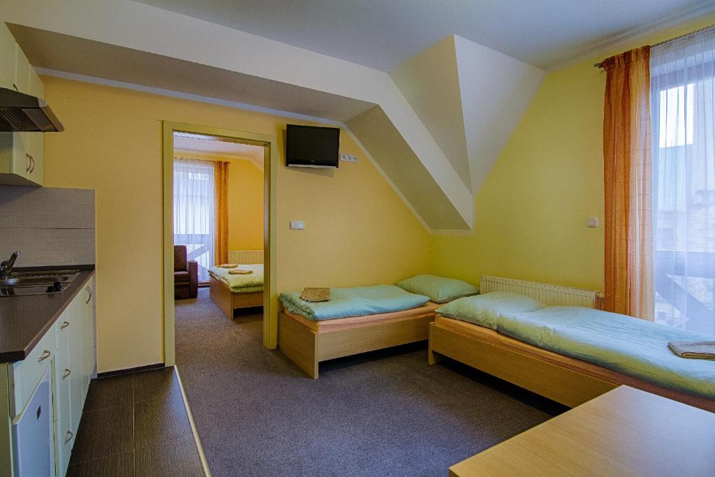 Postel nebo postele na pokoji v ubytování Apartmány Sport with Garage