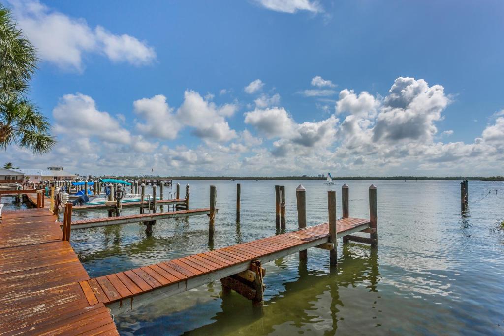 a dock on a large body of water at Riverside Club in Marco Island