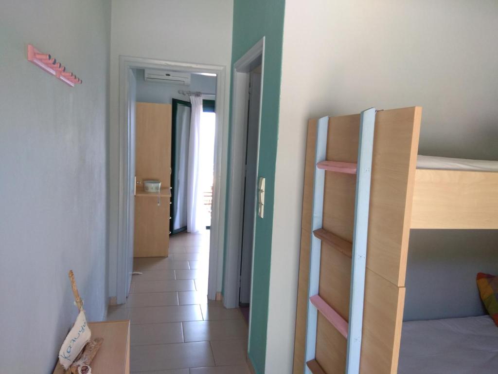 Postel nebo postele na pokoji v ubytování Elina Apartments