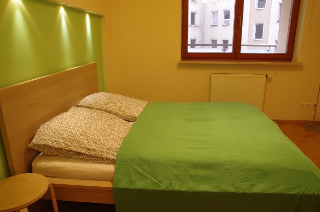 Posteľ alebo postele v izbe v ubytovaní Szucha Apartments