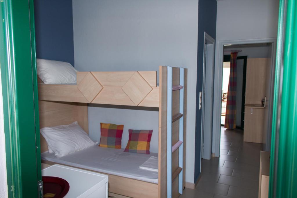 Postel nebo postele na pokoji v ubytování Elina Apartments