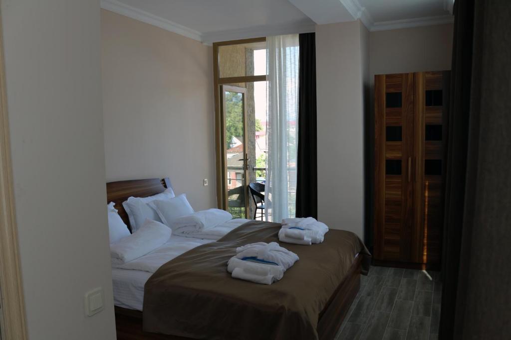 Postel nebo postele na pokoji v ubytování Hotel Lazi