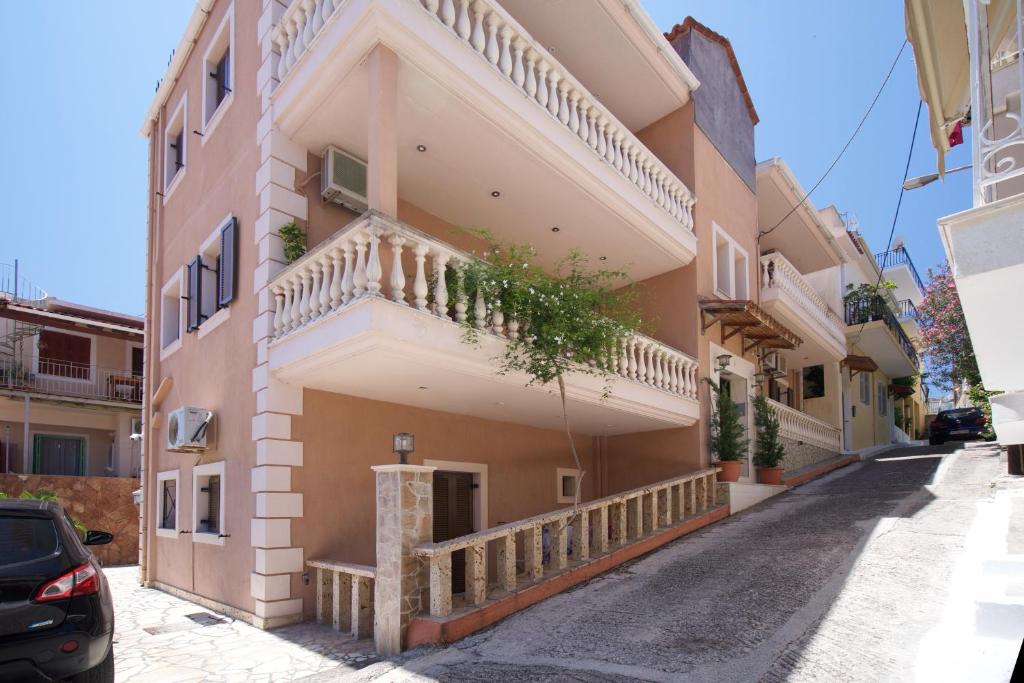 a house with a balcony on a street at Dias Ground Floor Apartment in Argostoli