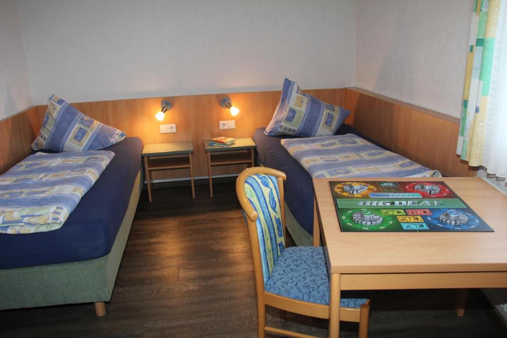 Postel nebo postele na pokoji v ubytování Lug ins Land Restaurant & Ferienwohnungen