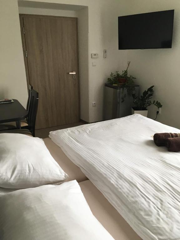 Postel nebo postele na pokoji v ubytování Hotel Jordánek