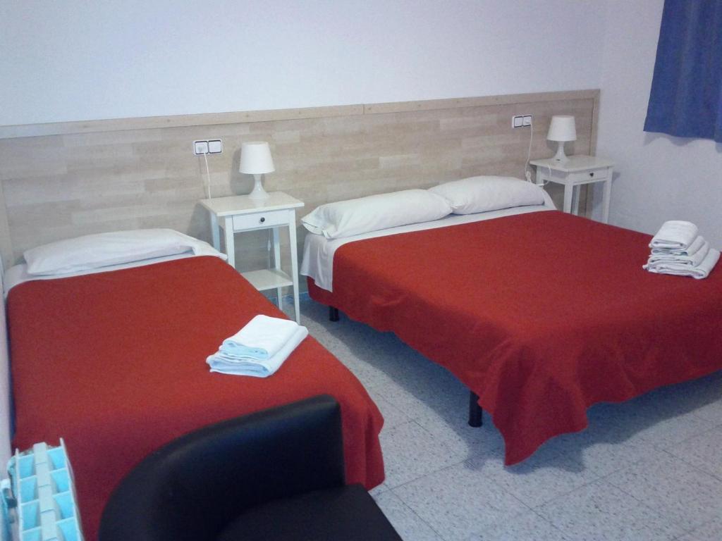 Postel nebo postele na pokoji v ubytování Hostal River