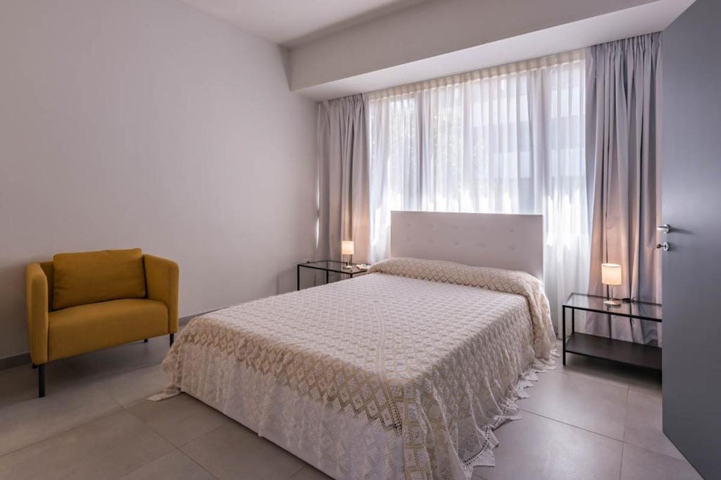 Łóżko lub łóżka w pokoju w obiekcie Le Residenze di Don Nino (Suites & Apartments)