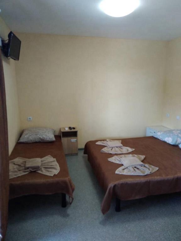 Postel nebo postele na pokoji v ubytování Mini gostinitsa HOSTEL