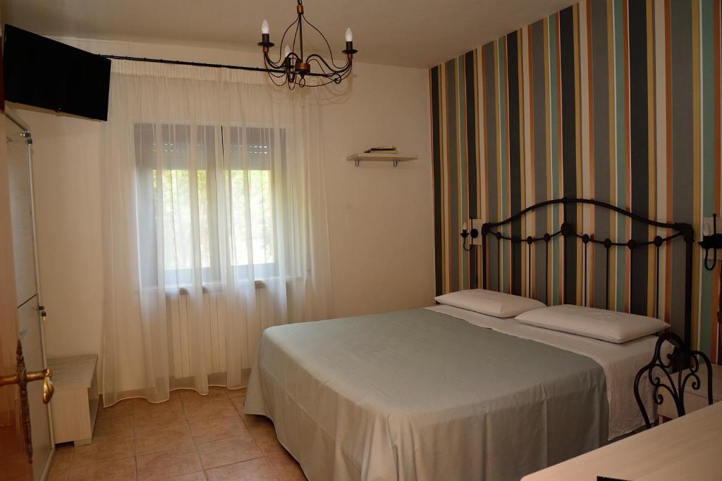 Postel nebo postele na pokoji v ubytování Alloggio nonna Cornelia