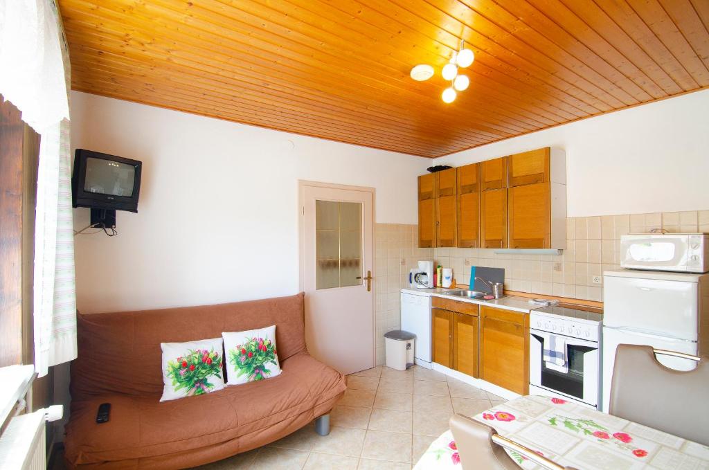 Kuchyň nebo kuchyňský kout v ubytování Apartments and Rooms Banić