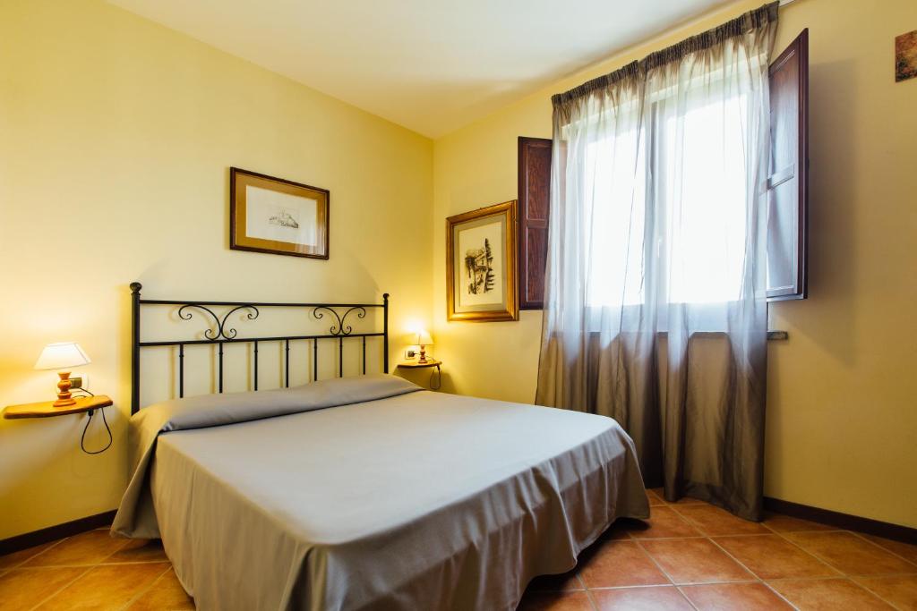 Postel nebo postele na pokoji v ubytování Borgo Venecca