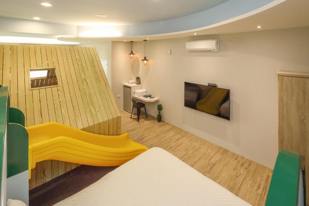 Postel nebo postele na pokoji v ubytování Happiness Yes Inn