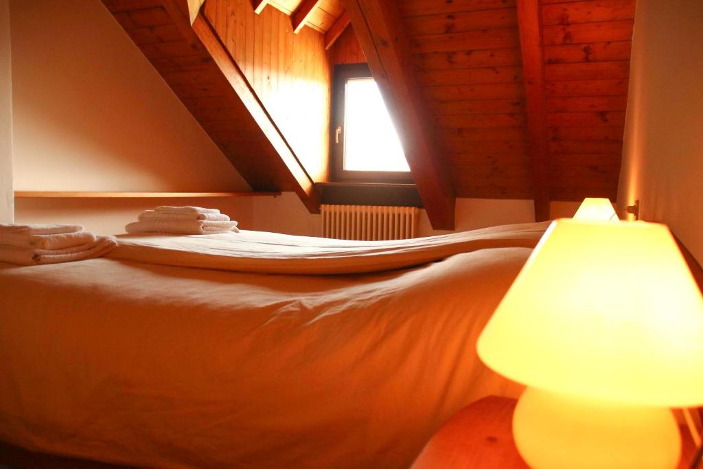 Posteľ alebo postele v izbe v ubytovaní Locanda Aurora B&B