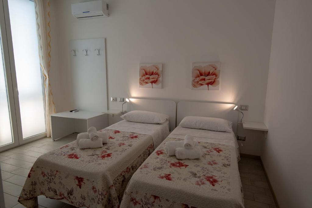 Postel nebo postele na pokoji v ubytování B&B ARCHIMEDE