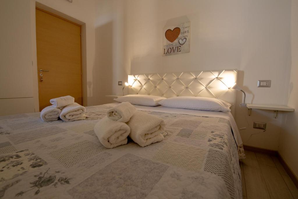 Postel nebo postele na pokoji v ubytování B&B ARCHIMEDE