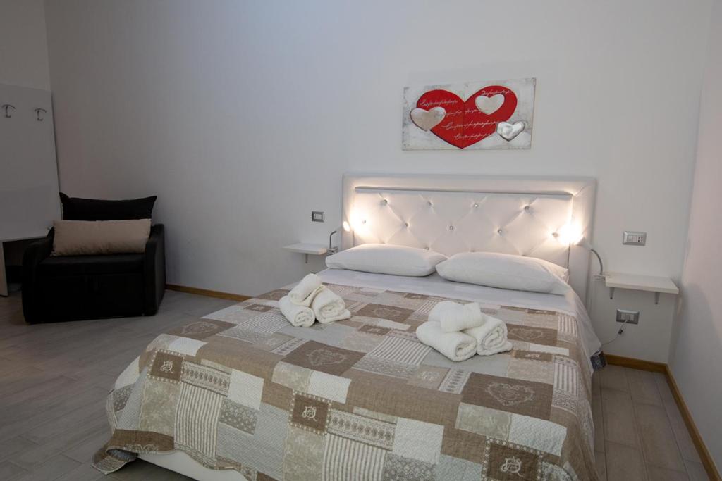 Postel nebo postele na pokoji v ubytování B&B ARCHIMEDE