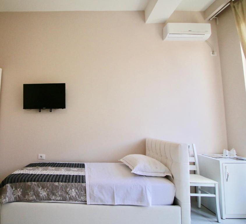 Llit o llits en una habitació de Hotel Orestiada