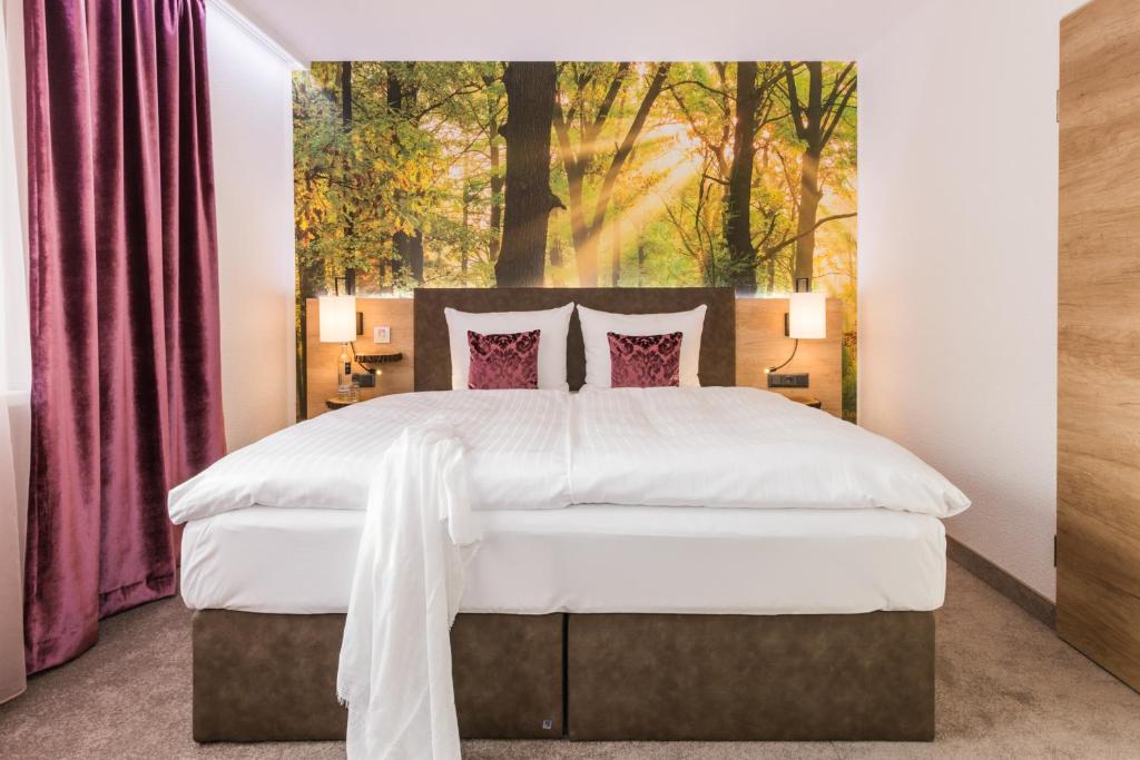 Postel nebo postele na pokoji v ubytování Trihotel Rostock - Wellnesshotel Adults Only
