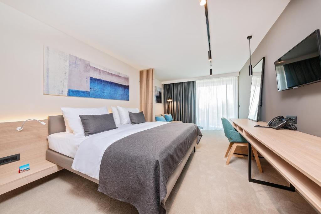 Postel nebo postele na pokoji v ubytování Hotel Park Plava Laguna