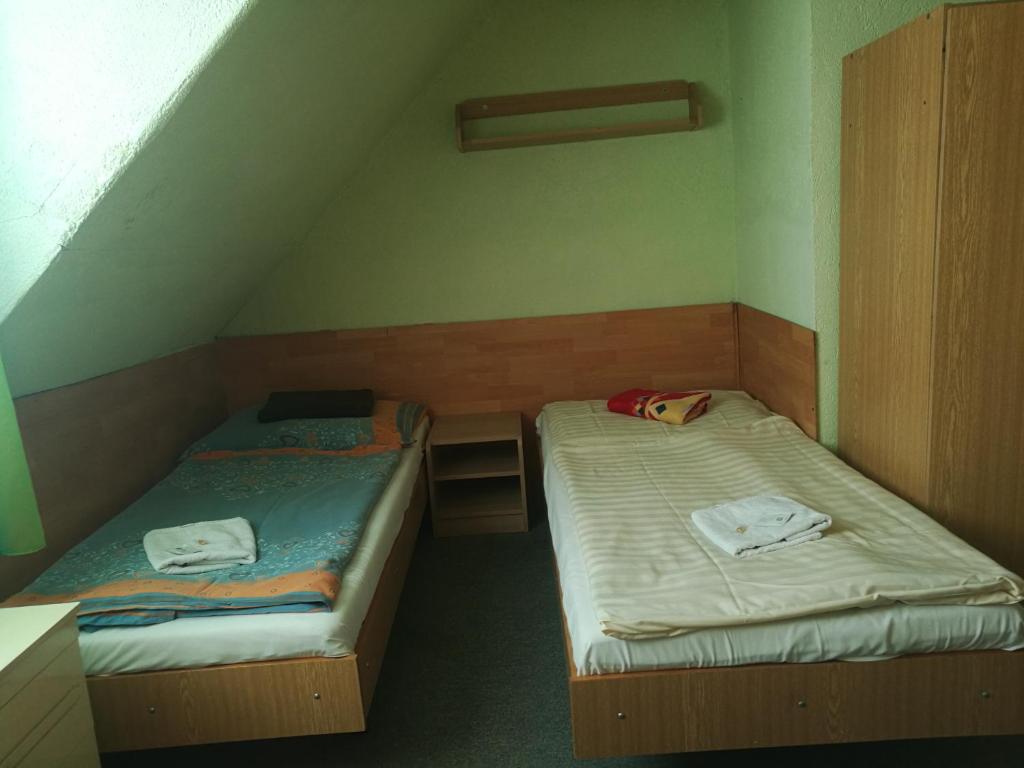 Postel nebo postele na pokoji v ubytování Hotel Chata