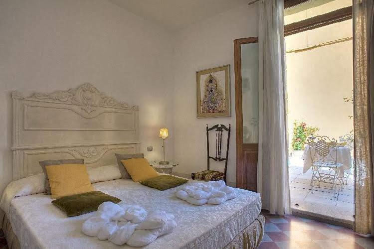 Łóżko lub łóżka w pokoju w obiekcie Art Hotel Al Fagiano