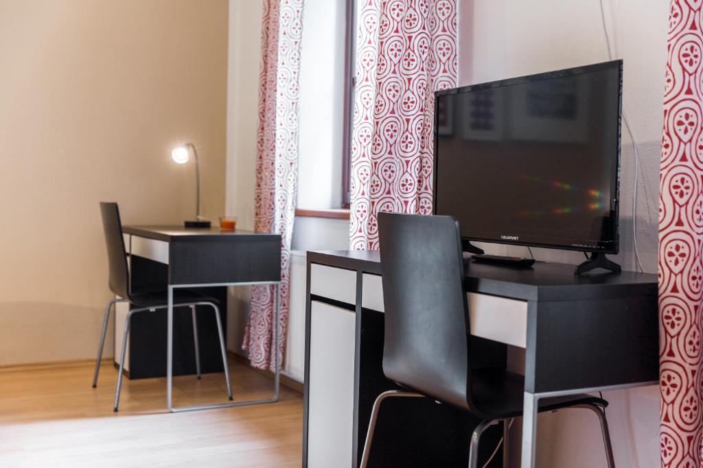 TV a/nebo společenská místnost v ubytování Apartmány Zadní mlýn
