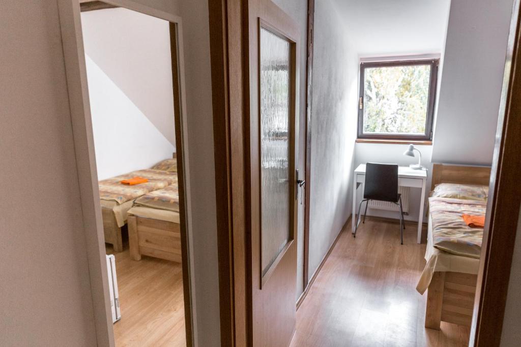Postel nebo postele na pokoji v ubytování Apartmány Zadní mlýn