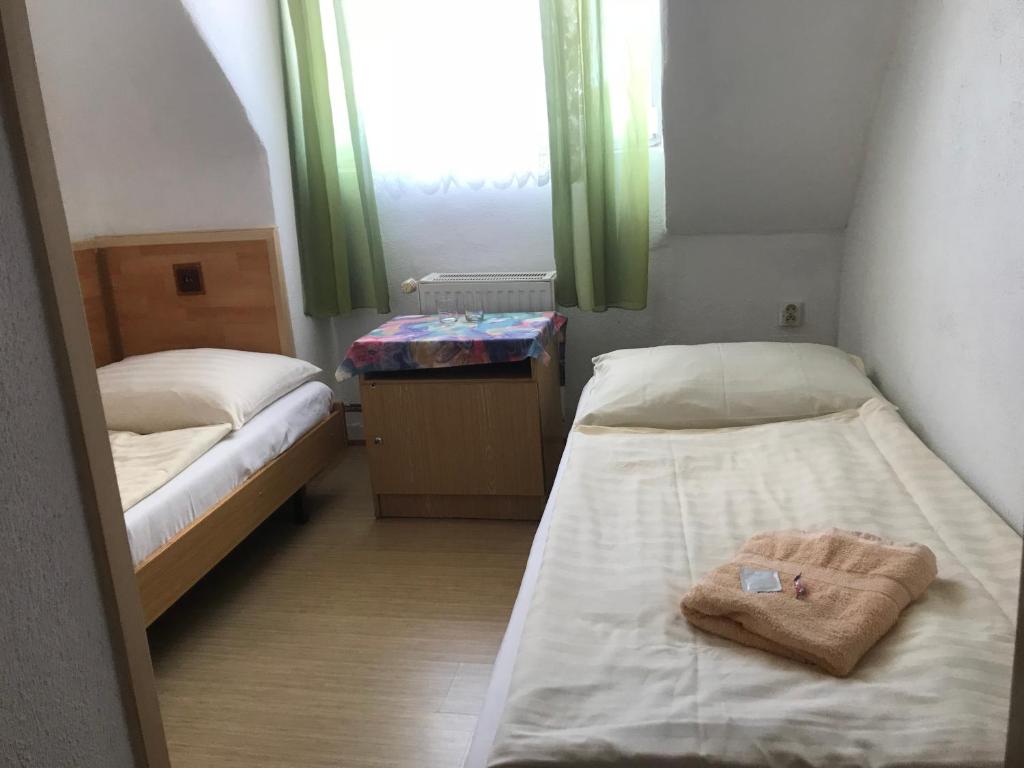 Postel nebo postele na pokoji v ubytování Hotel Chata