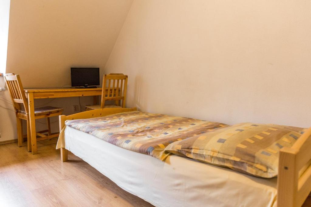 Postel nebo postele na pokoji v ubytování Apartmány Zadní mlýn