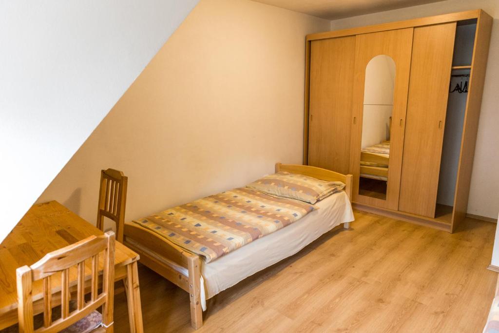 Postel nebo postele na pokoji v ubytování Apartmány Zadní mlýn