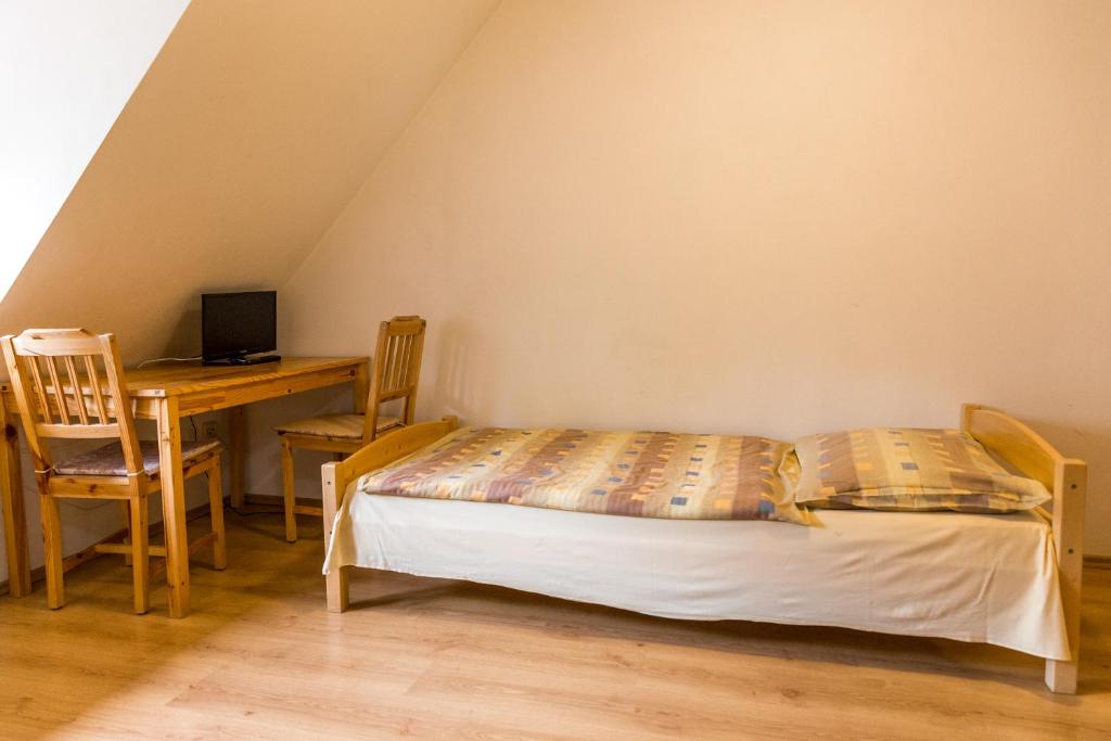 Postel nebo postele na pokoji v ubytování Apartmány Zadní mlýn