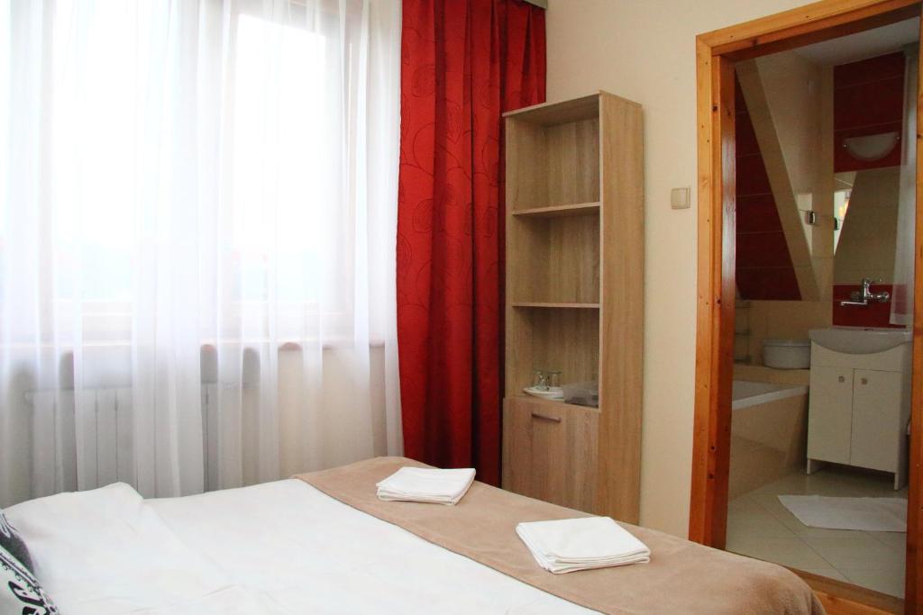 Posteľ alebo postele v izbe v ubytovaní Pokoje Gościnne Maria