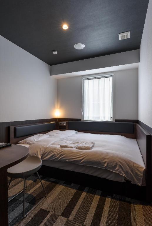 Postel nebo postele na pokoji v ubytování Belken Hotel Kanda