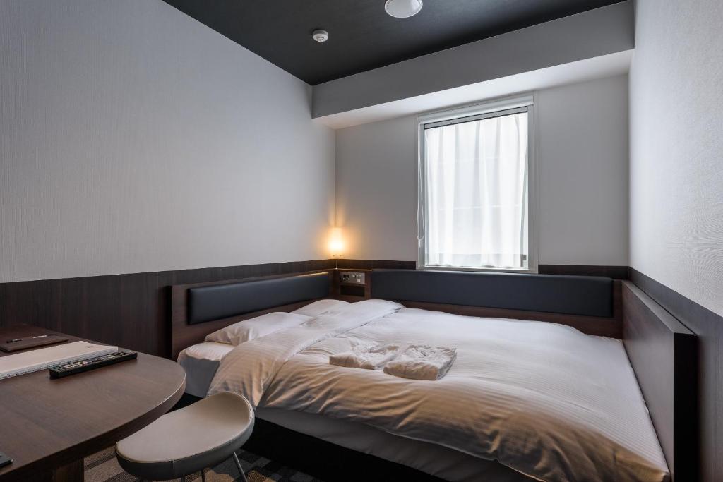 Postel nebo postele na pokoji v ubytování Belken Hotel Kanda