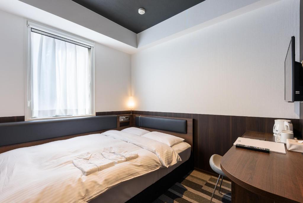 Postel nebo postele na pokoji v ubytování Belken Hotel Kanda