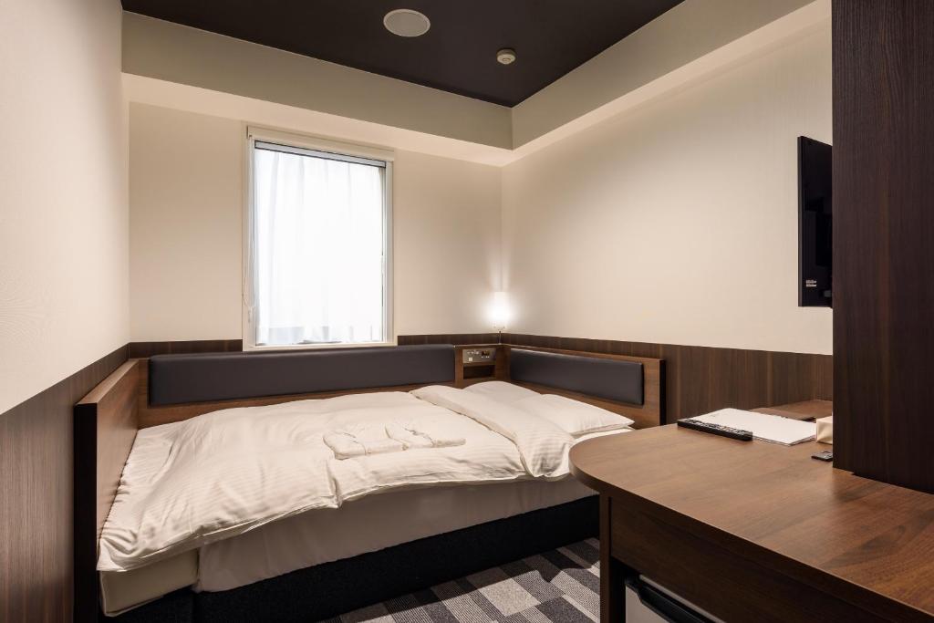 Postel nebo postele na pokoji v ubytování Belken Hotel Kanda