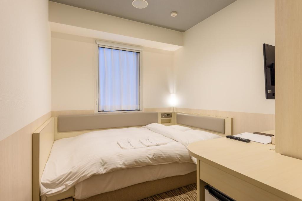 Postel nebo postele na pokoji v ubytování Belken Hotel Kanda