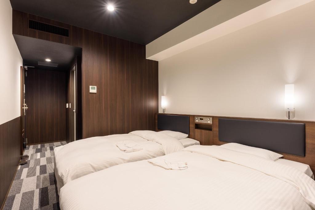 Postel nebo postele na pokoji v ubytování Belken Hotel Kanda