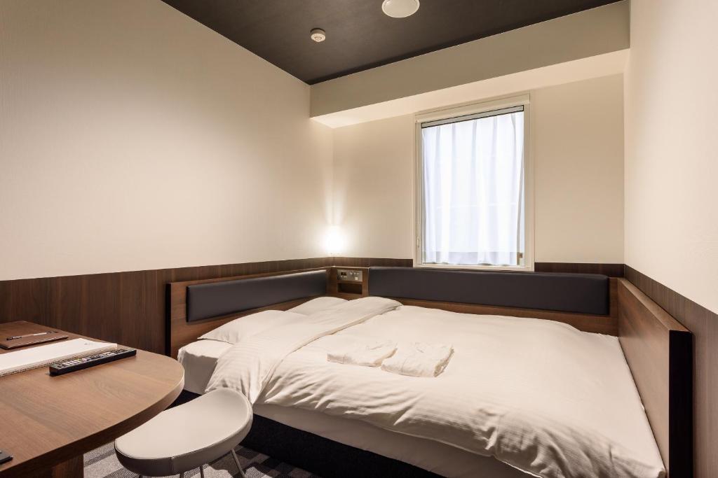 Postel nebo postele na pokoji v ubytování Belken Hotel Kanda