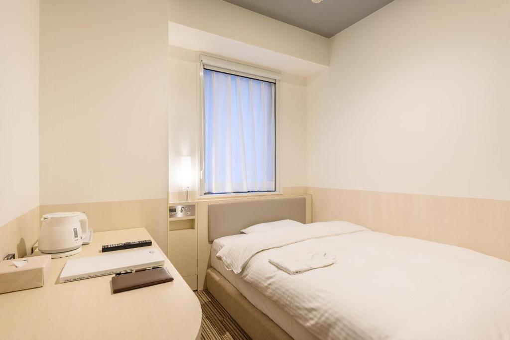 Postel nebo postele na pokoji v ubytování Belken Hotel Kanda