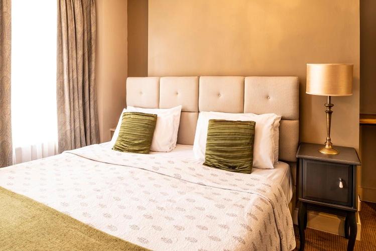 Postel nebo postele na pokoji v ubytování Fielding Hotel