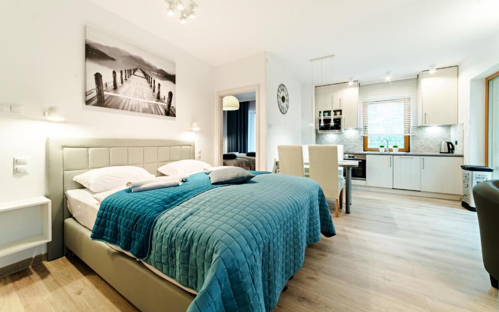Posteľ alebo postele v izbe v ubytovaní Apartamenty Sun & Snow Sarnia Residence