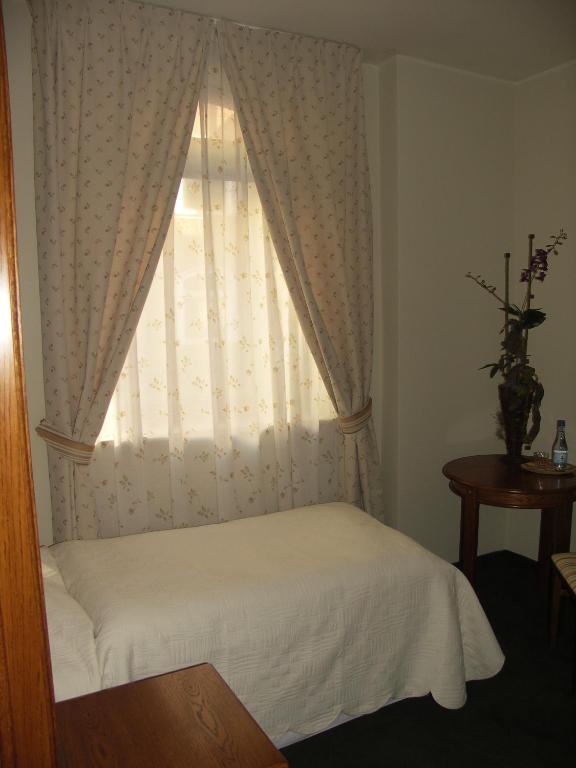 Ein Bett oder Betten in einem Zimmer der Unterkunft Willa Biala Lilia Old Town
