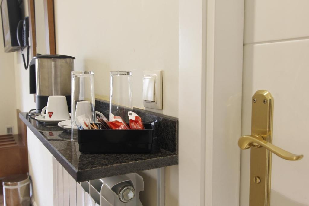a tray of utensils on a counter in a bathroom at Rincón de Gran Vía in Madrid