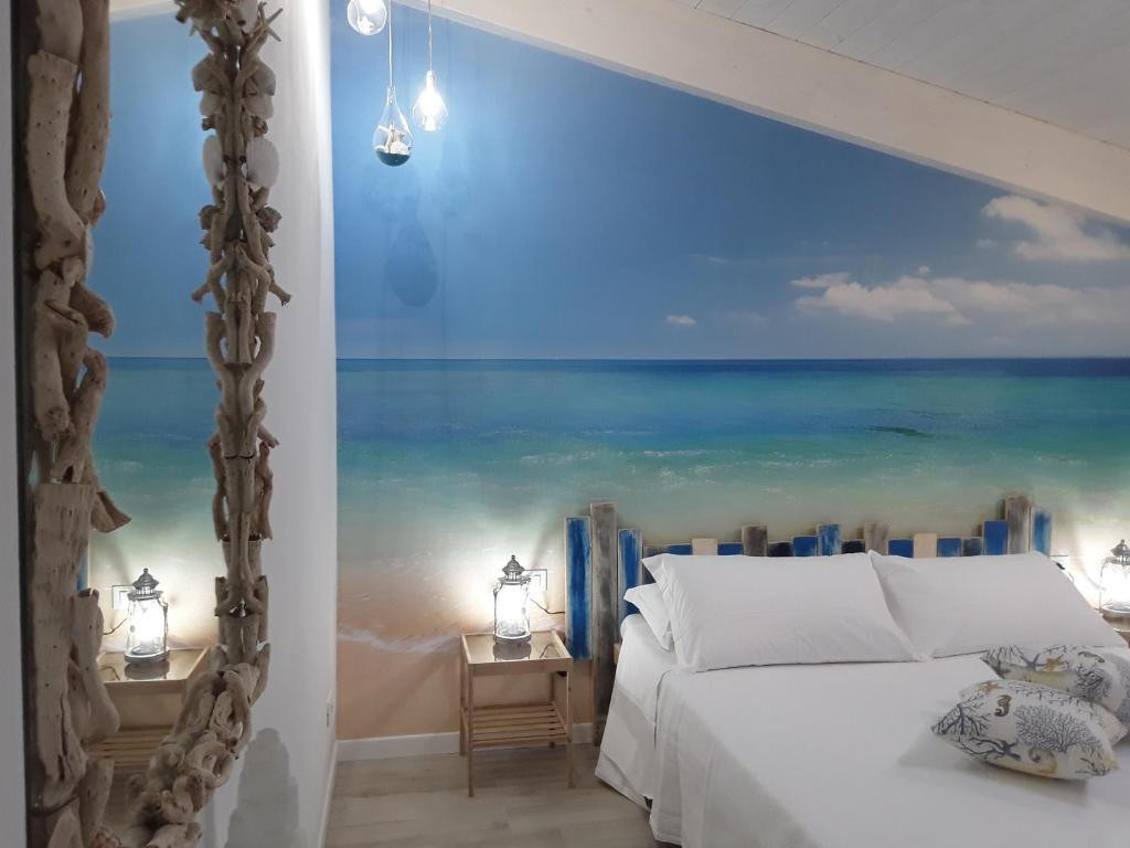 Postel nebo postele na pokoji v ubytování Acquamarina b&b