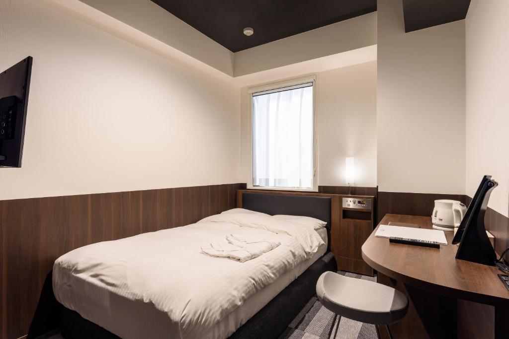 Postel nebo postele na pokoji v ubytování Belken Hotel Kanda